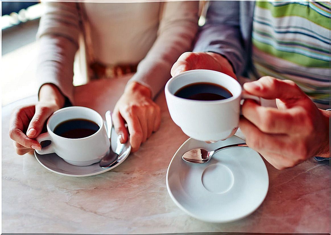 Coffee cups and hands.