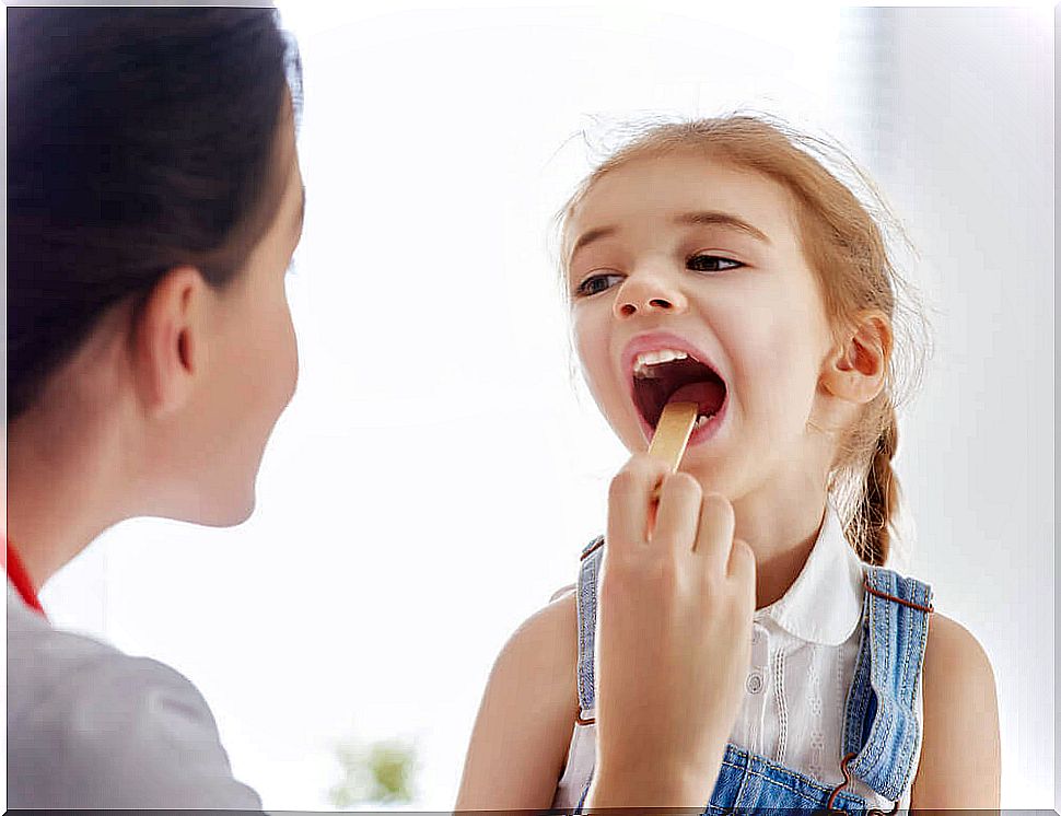 Little girl with plates in her throat