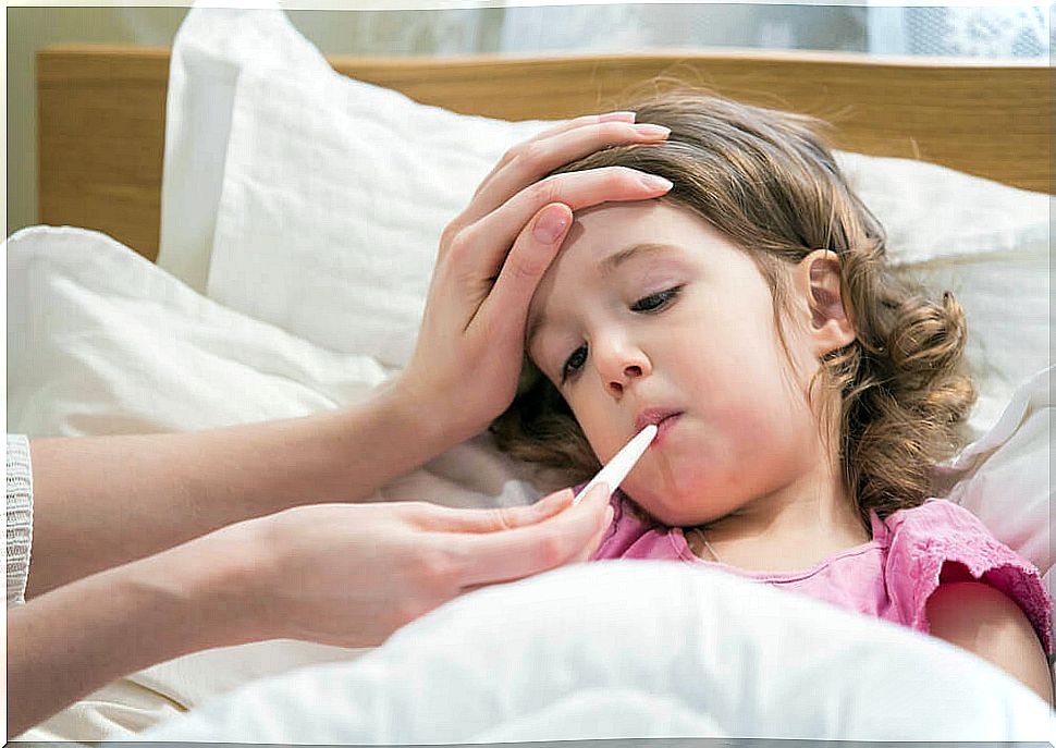 Little girl in bed with flu