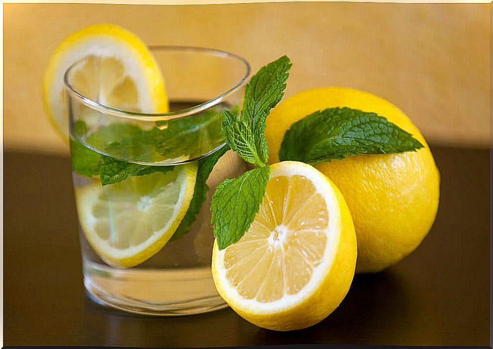 Glass with lemon water.