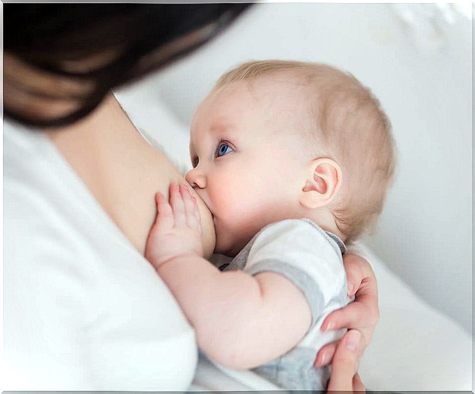 woman breastfeeding baby