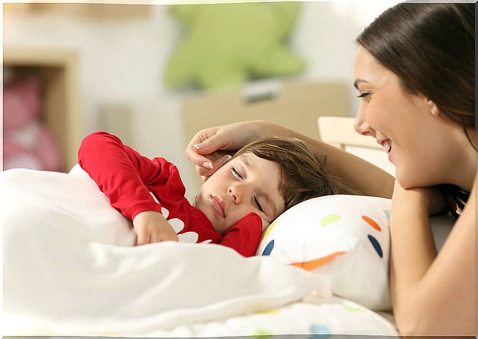 Sleeping boy and his mother next to him.